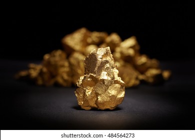 Closeup Of Big Gold Nugget On A Black Background