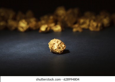 Closeup Of Big Gold Nugget On A Black Background