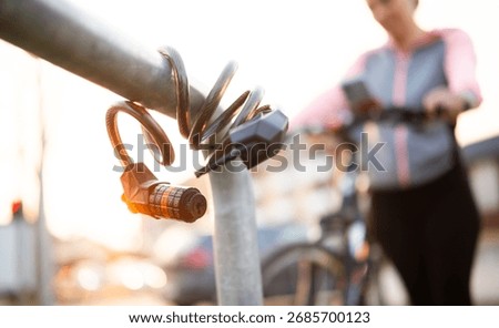 Close-Up Of A Bike Code Lock On A Bicycle Parking Rack