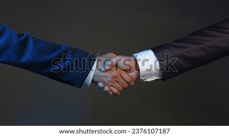 Close-up of biz partners shake hands, beneficial decision, support each other, confirm deal. Businesspeople on meeting. Contract, deal, greeting concept