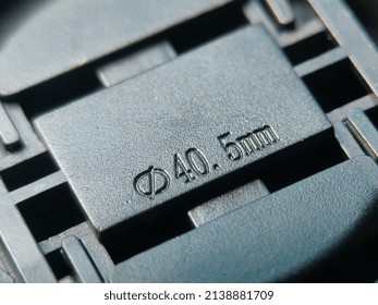 Close-up of a black 40.5mm macro lens cover. - Powered by Shutterstock