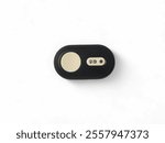 A close-up of a black Bluetooth camera remote with white buttons for camera,Wireless Remote control for DSLR camera. Isolated on white background