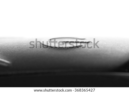 Close-up of a black button on the electronic device