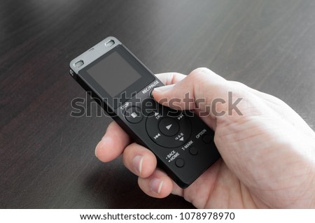 Closeup Black Digital Recorder Holding by Audience Hand in Meeting for Recording Lecture Voice