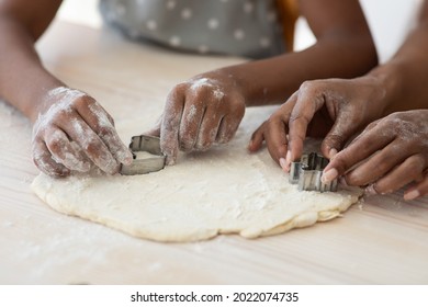 Closeup Of Black Family Mother And Daughter Hands Making Diverse Figures With Cookie Cutters, Happy African American Mom And Kid Baking Together At Home, Using Biscuit Figurines, Baking Concept