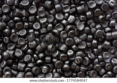 Close-up of black plastic polymer granules. polymer plastic. compound polymer.