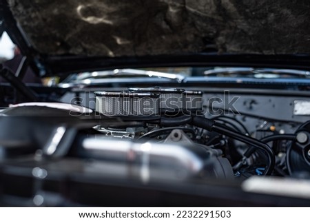 closeup of a black pontiac gto at a car show