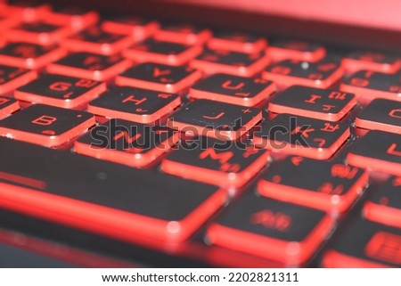 Closeup black and red computer keyboard, Light red keyboard, Dirty computer keyboard