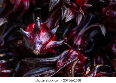 Close-up of black sorrel, or hibiscus sabdariffa, in a bowl at a farmer's market in Trinidad and Tobago. Sorrel blooms at Christmas, and is used to make wine and juice. Hibiscus flower, spiky, tart.
