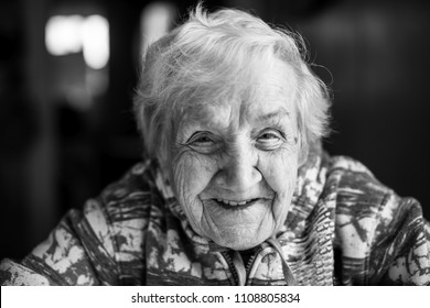 Close-up Of Black And White Portrait Of An Elderly Woman.