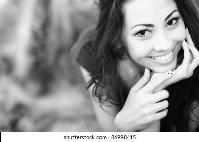 Closeup Black And White Portrait Of A Happy Young Woman Smiling