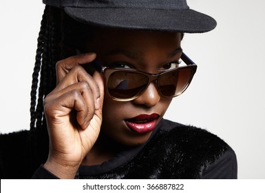 closeup black woman's eyes watching over glasses