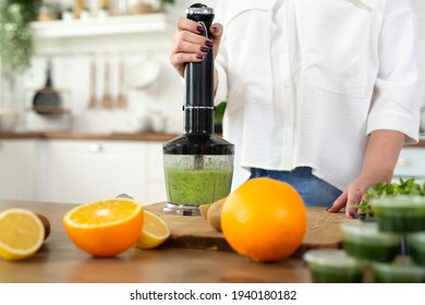 Close-up Of The Blender Process. I'm Making A Green Smoothie With Whitgrass. Mixing In A Blender Bowl.