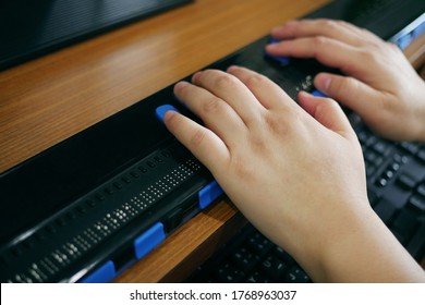 Close-up Blind Person Hands Using Computer With Braille Display Or Braille Terminal A Technology Assistive Device For Persons With Visual Disabilities.