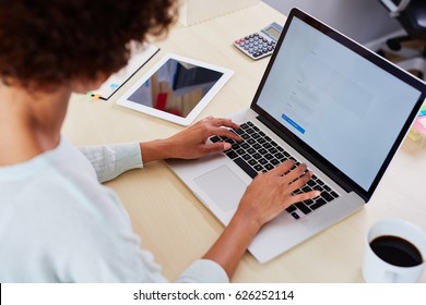 Closeup Of Blogger Writing Comments On Blog Using Her Laptop