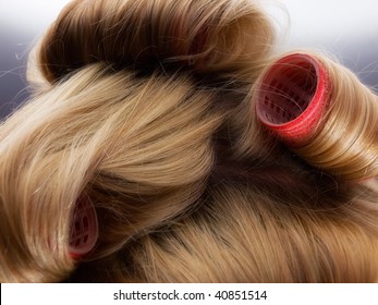 Closeup Of Blond Hair During Hair Dressing With Curler.