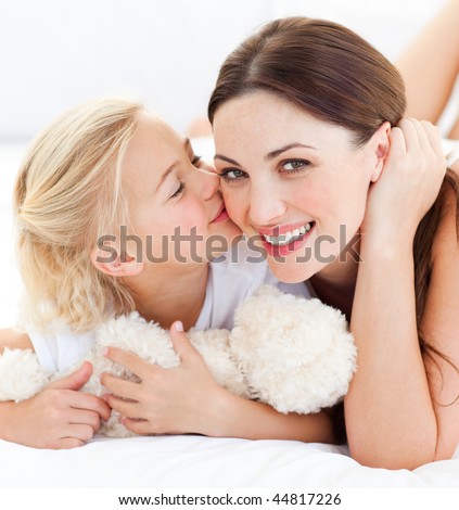 Similar – Image, Stock Photo Little girl kissing her mother lying on bed and enjoy the time at home. Mother’s Day or mother’s love concept image
