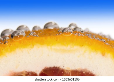 Close-up Of A Blood Orange Peel With Water Droplets.