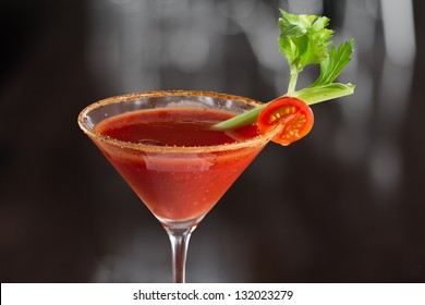 closeup of a bloody mary cocktail isolated on a busy bar top