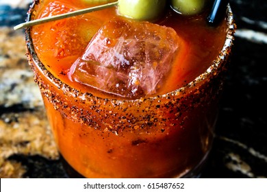 A close-up of a bloody mary type drink or cocktail.  