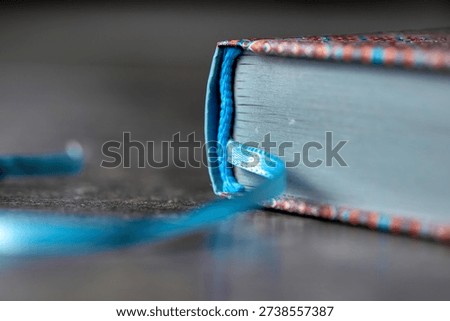 Close-up of Blue Book Binding and Patterned Cover