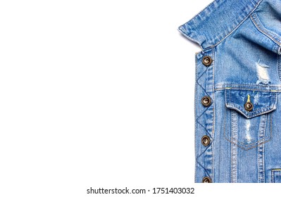 Close-up Blue denim jacket on isolated white background top view flat lay copy space. Denim, fashionable jacket, women's or men's trend clothing, fashion background. Denim texture