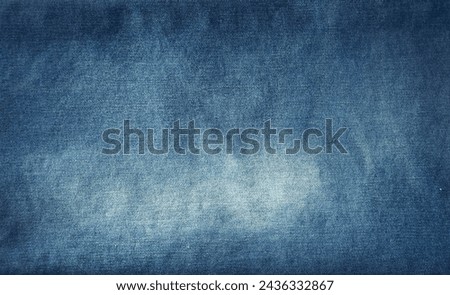 Close-up of blue denim jeans fabric texture background
