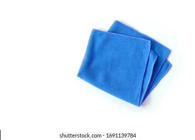 Closeup blue duster microfiber cloth for cleaning isolated on white background . Top view. Flat lay. Clipping path.