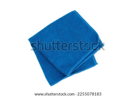Closeup blue duster microfiber cloth for cleaning isolated on white background. Top view. Flat lay.