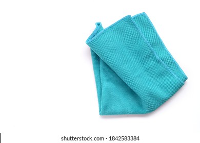 Closeup blue duster microfibre cloth for cleaning isolated on white background . Top view. Flat lay. Clipping path. Copy space.