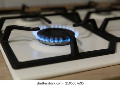 Close-up Of A Blue Flame Of Fire From A Home Cooking Stove. The Concept Of Industrial Resources And Economy. Gas Stove With A Burning Flame.Propane.Close-up.Copy Space.