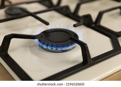 Close-up Of A Blue Flame Of Fire From A Home Cooking Stove. The Concept Of Industrial Resources And Economy. Gas Stove With A Burning Flame.Propane.Close-up.Copy Space.