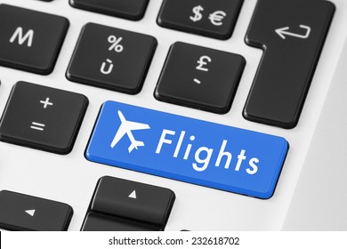 Close-up of blue flights button on keyboard for online check-in