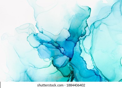 Closeup of blue and green alcohol ink abstract texture, trendy wallpaper. Art for design project as background for invitation or greeting cards, flyer, poster, presentation, wrapping paper