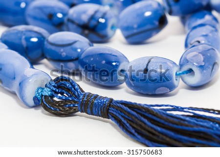 Closeup of Blue Masbaha ,Muslim Tasbih - muslim rosary isolated on white background