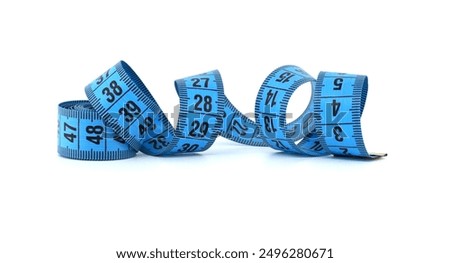 Close-up of a blue measuring tape curled on a white background symbolizing fitness, measurement, and precision.