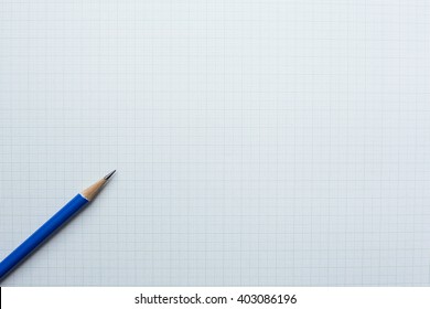 Close-up Blue Pencil On Graph Paper Background