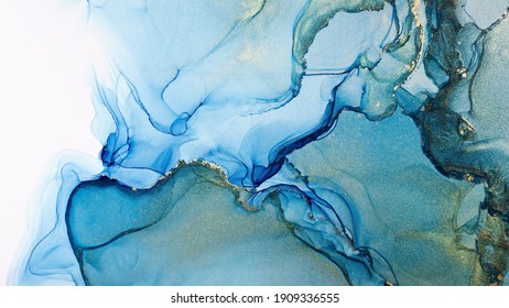 Closeup of blue and shiny golden alcohol ink abstract texture, trendy wallpaper. Art for design project as background for invitation or greeting cards, flyer, poster, presentation, wrapping paper