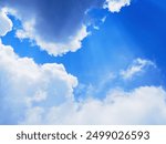 Closeup of a blue sky with heavy clouds during the day