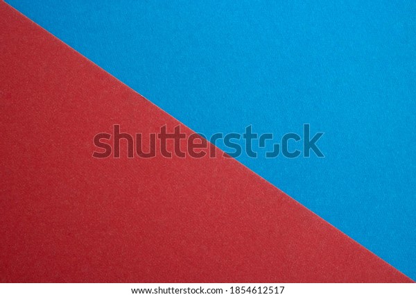 A\
close-up of blue suede and red is divided in half by the ratio of\
the textured background, the separation of\
fabrics