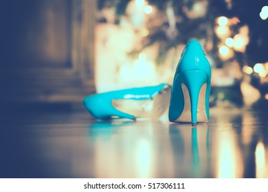 close-up of blue / turquoise party shoes with golden bottom. Selective focus.