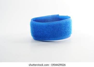 A Closeup Of A Blue Velcro Strap Isolated On White Background