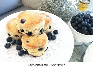 Close-up blueberry scones in perfect afternoon tea on the table. - Powered by Shutterstock