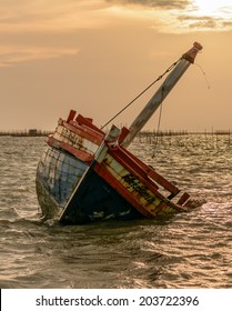 Closeup Boat Capsized In The Sea