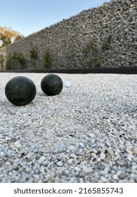 Closeup Of Bocce Balls In Court With Background Wall