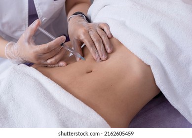 Close-up Of Body Mesotherapy Injections On The Female Belly, Cellulite Treatment. Female Aesthetic Cosmetology In A Beauty Salon.