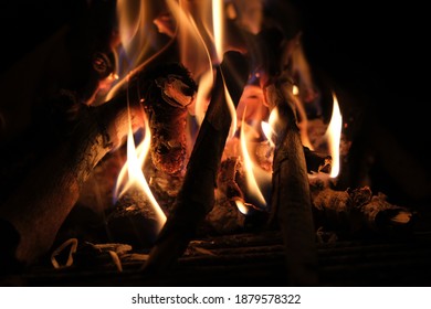 close-up of bonfire flames in the dark - Shutterstock ID 1879578322
