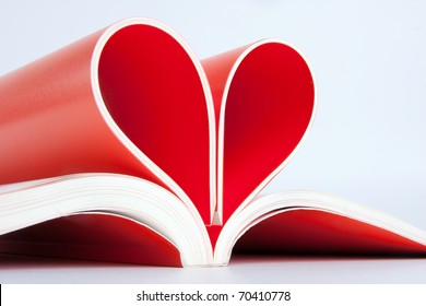 Close-up Of Book Pages Folded Into A Heart Shape