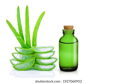 Closeup bottle of aloe vera essential oil extract with aloevera leaf and cut sliced isolated on white background. Skin care, health, beauty and spa concept. - Powered by Shutterstock