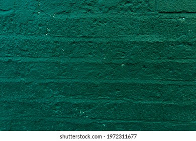 Close-up of the bottle green painted brick wall background texture - Shutterstock ID 1972311677